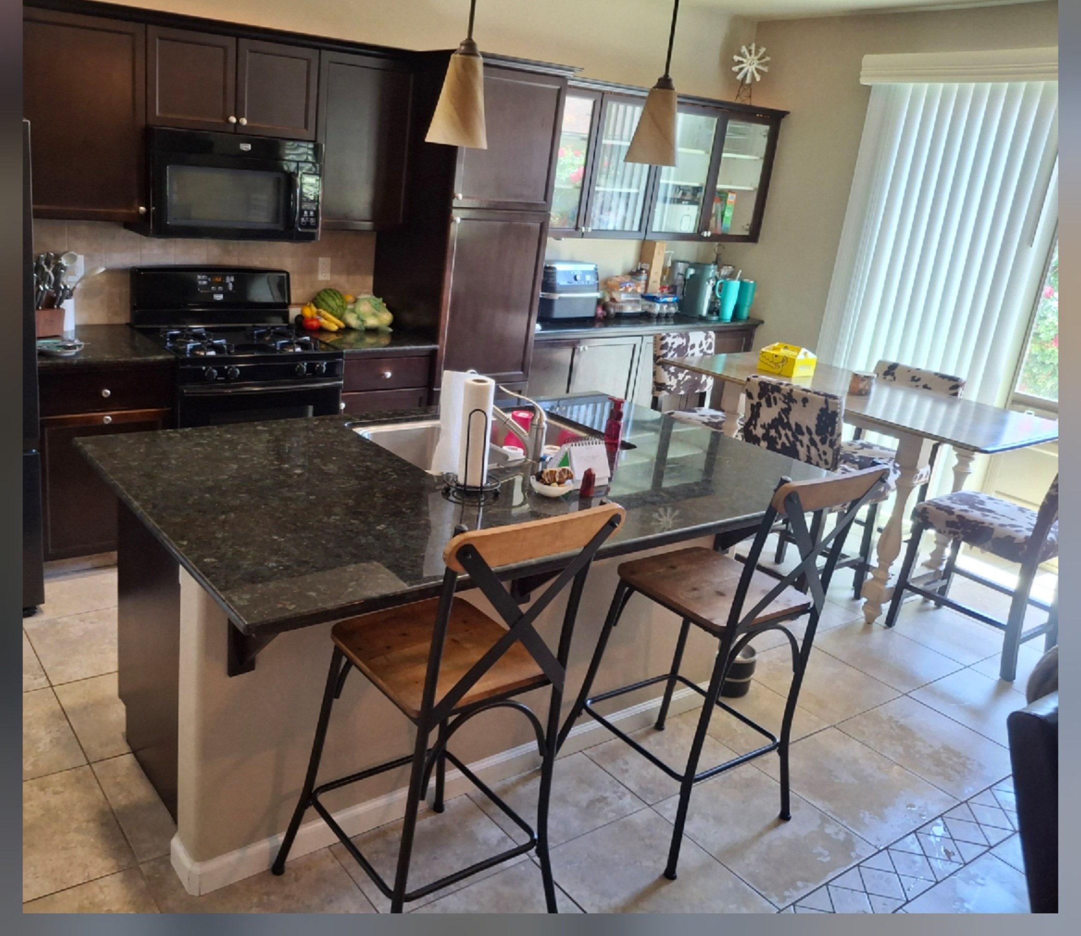 Kitchen island covered in clutter before and wiped clean and styled after