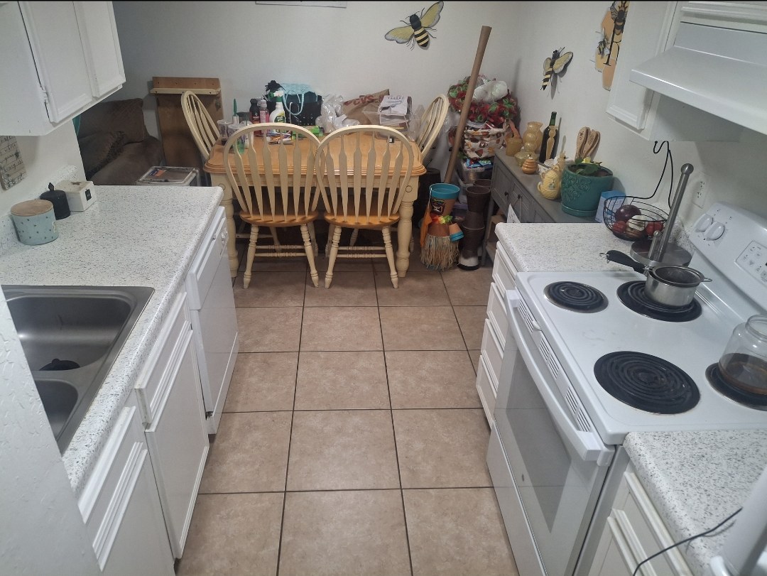 Galley kitchen piled with dishes before and fully cleared and cleaned after